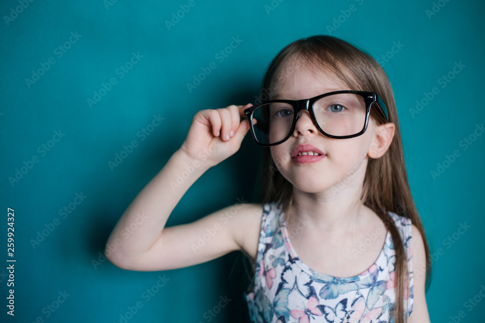 serious little girl with big glasses serious little girl with big glasses