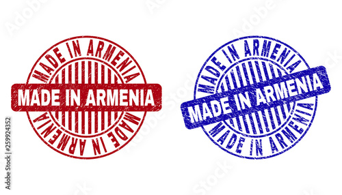 Grunge MADE IN ARMENIA round stamp seals isolated on a white background. Round seals with grunge texture in red and blue colors.