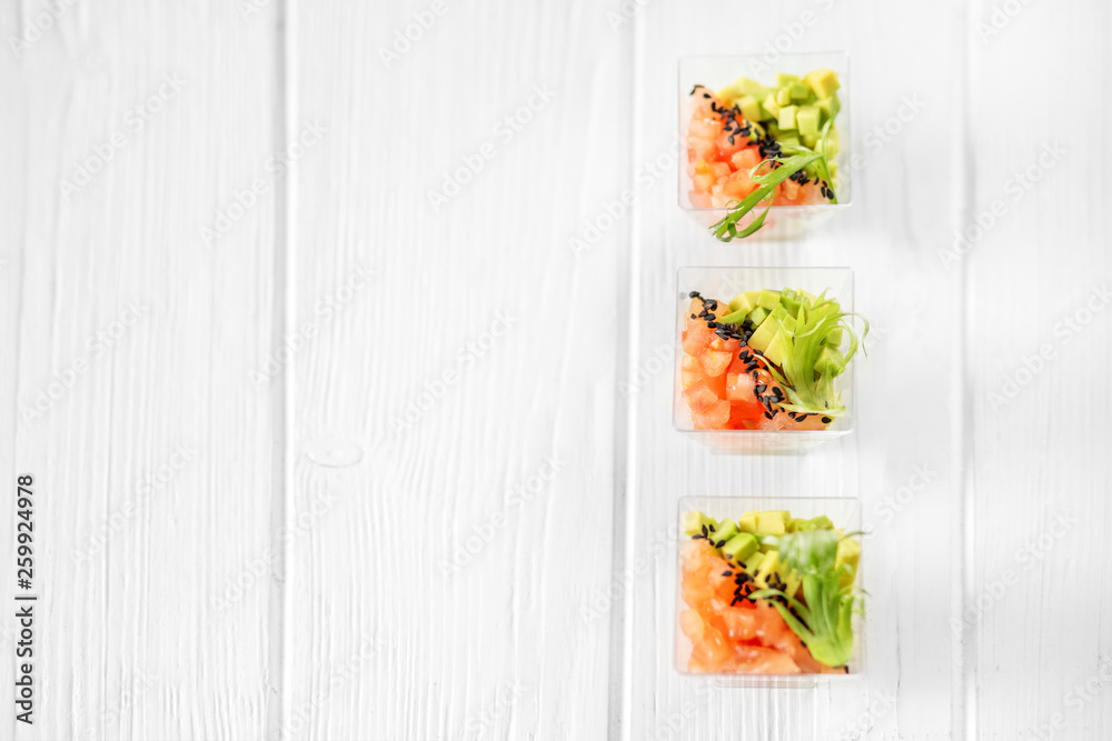Delicious vegetable appetizers with avocado and tomato in cups. Concept for food, diet, healthy food, restaurant and catering. Delicious vegetable appetizers with avocado and tomato in cups. Concept for food, diet, healthy food, restaurant and catering.