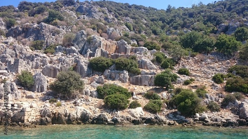 The sunken ruins on the island of Kekova Dolichiste of the ancient Lycian city of ancient Simena, was destroyed by an earthquake, rebuilt and existed until the Byzantine era. Antalya, Turkey. photo