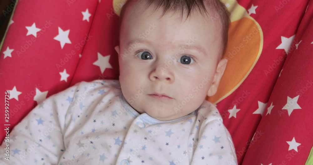 Baby is happy in the cradle