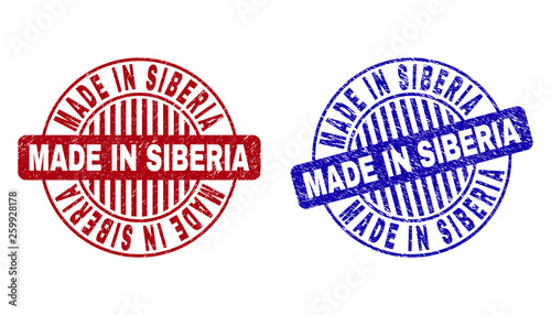Grunge MADE IN SIBERIA round stamp seals isolated on a white background. Round seals with grunge texture in red and blue colors.