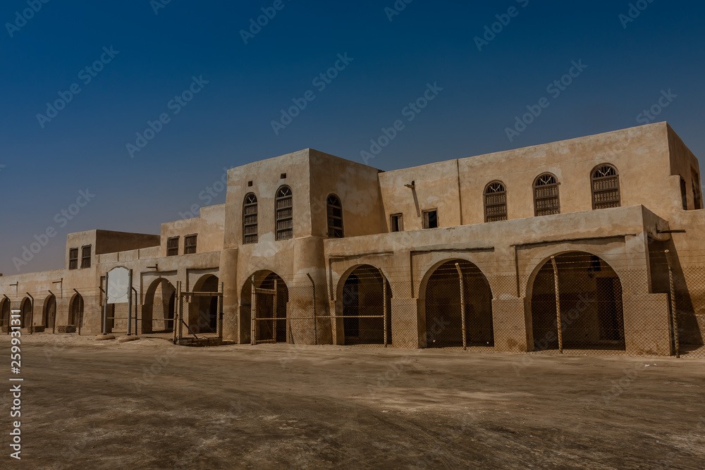 A facade and entrance to Aqeer Castle, Saudi Arabia