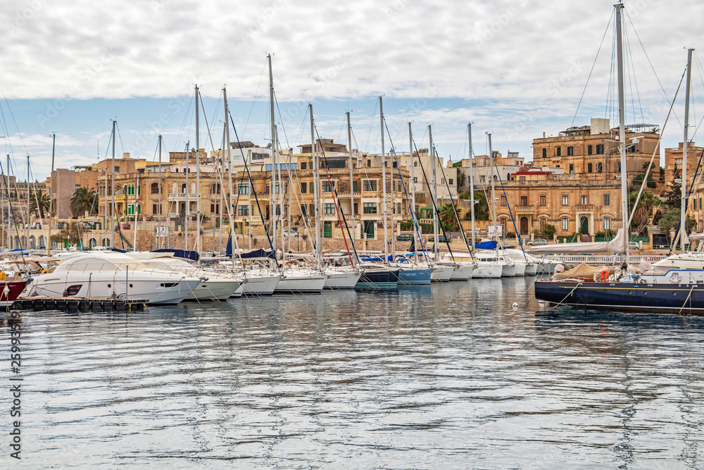 Yacht MarManoel Island Yacht Marina with sailboats and the architecture of the town of Ta'Xbiex, Malta in the backgroundina with sailboats and Maltese architecture Yacht MarManoel Island Yacht Marina with sailboats and the architecture of the town of Ta'Xbiex, Malta in the backgroundina with sailboats and Maltese architecture