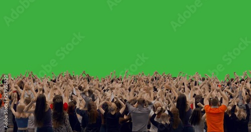 GREEN SCREEN CHROMA KEY Model released, back view of huge crowd jumping and cheering at a concert or a show. Crowd replication techique. 4K UHD ProRes 4444
