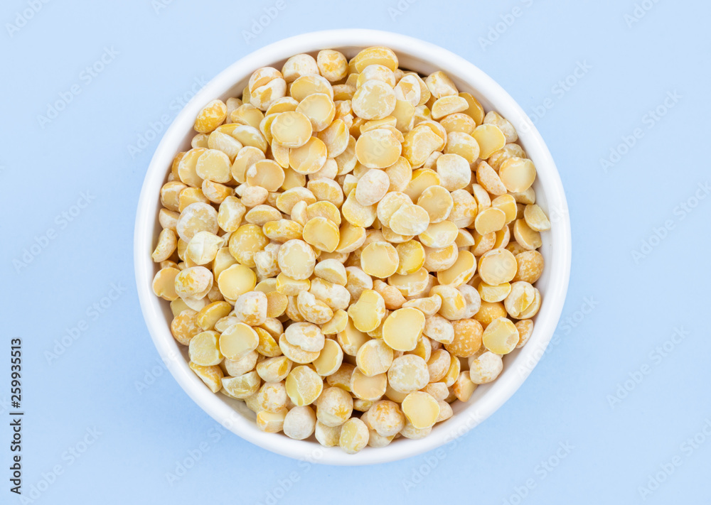 peas in a plate on top, on a blue background, copy space peas in a plate on top, on a blue background, copy space