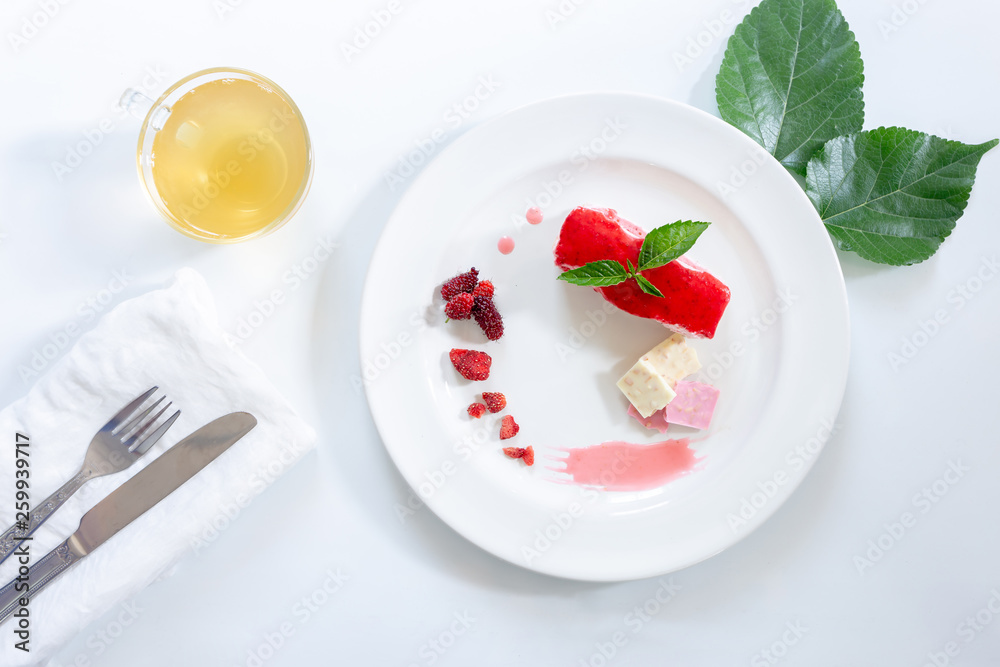Cake strawberry yogurt with tea on white backgrounds Cake strawberry yogurt with tea on white backgrounds