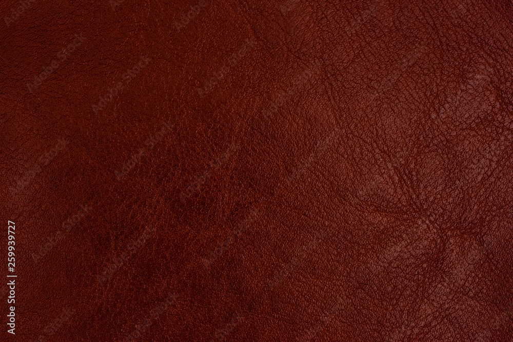 Close-up brown leather texture to background. Abstract leather texture. Close-up brown leather texture to background. Abstract leather texture.