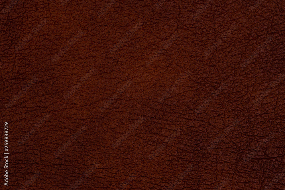 Close-up brown leather texture to background. Close-up brown leather texture to background.