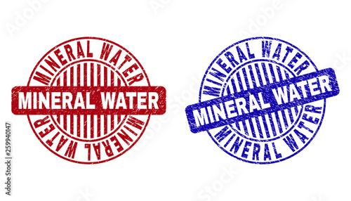Grunge MINERAL WATER round stamp seals isolated on a white background. Round seals with grunge texture in red and blue colors.