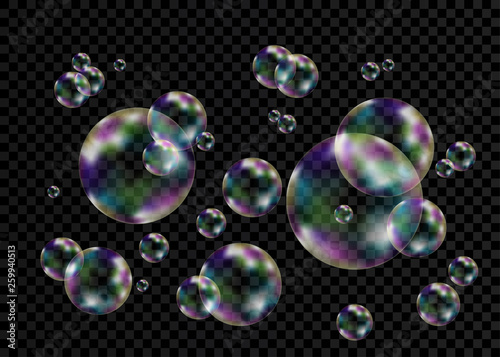 Colorful soap bubbles with rainbow reflection.