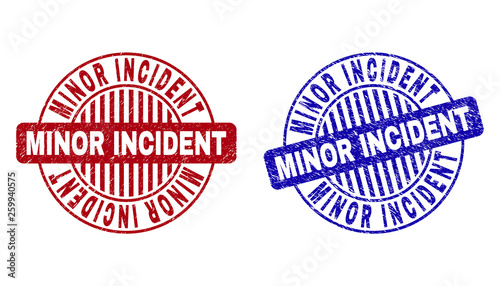 Grunge MINOR INCIDENT round stamp seals isolated on a white background. Round seals with distress texture in red and blue colors.