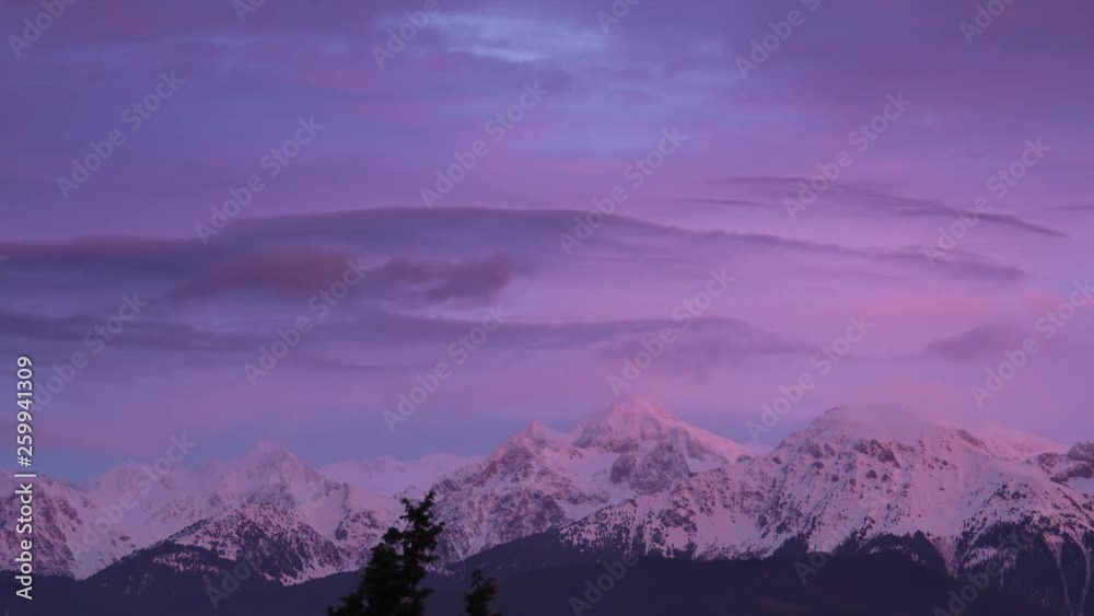 Pink sunset over the snowy mountains of Grenoble Pink sunset over the snowy mountains of Grenoble