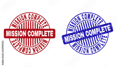 Grunge MISSION COMPLETE round stamp seals isolated on a white background. Round seals with grunge texture in red and blue colors.