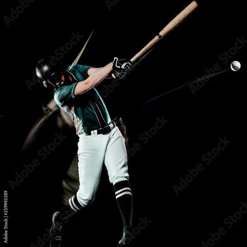 one caucasian baseball player man studio shot isolated on black background with light painting speed effect