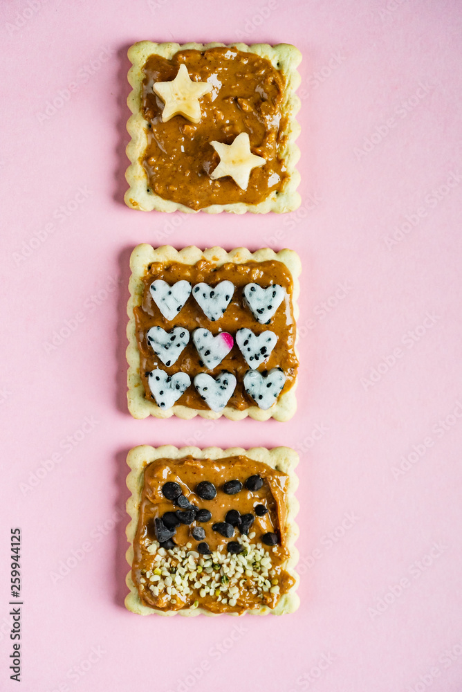 Delicious Toast with peanut butter on the pink background Delicious Toast with peanut butter on the pink background