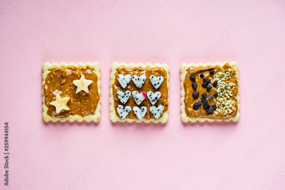 Delicious Toast with peanut butter on the pink background Delicious Toast with peanut butter on the pink background