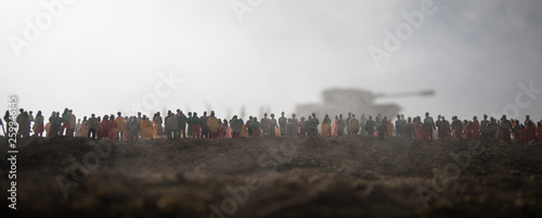Captured by enemy concept. Military silhouettes and crowd on war fog sky background. World War Soldiers and armored vehicles movement while scared people watching. Artwork decoration.