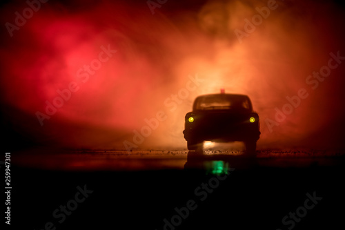 Police cars at night. Police car chasing a car at night with fog background. 911 Emergency response