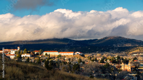 Golden hour light shines on a university in a small mountain town