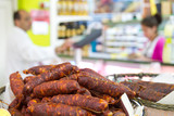 sausages in the foreground in supermarket