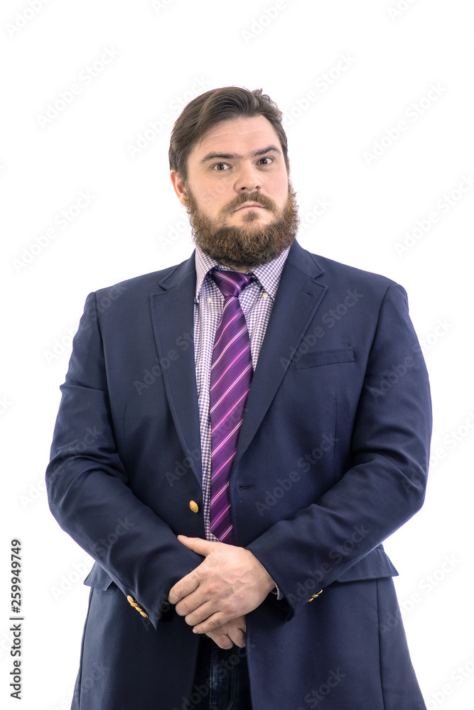 Portrait of a big handsome serious bearded business man in a dark suit and a bright blue tie, isolated on white Portrait of a big handsome serious bearded business man in a dark suit and a bright blue tie, isolated on white