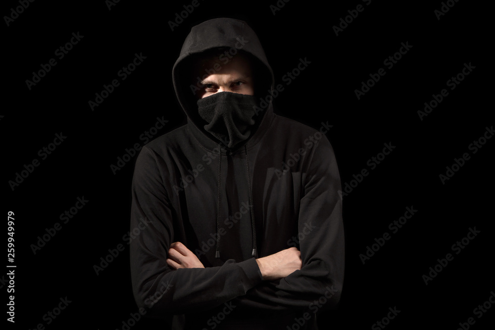 faceless man with open eyes in hoodie standing isolated on black faceless man with open eyes in hoodie standing isolated on black