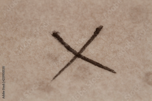 Cross mark handwriting on the old paper
