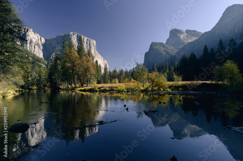 El Capitan and autumn colors reflected in the Merced River in early morning light in Yosemite National Park