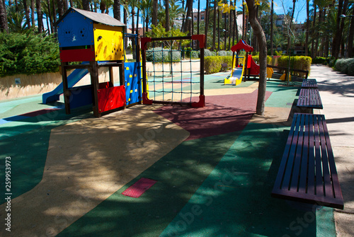 Child colorful playground  in the park. Kid summer recreation.