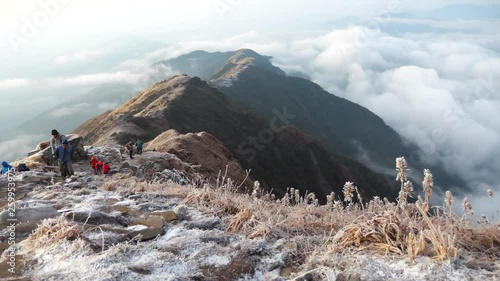 Group of Hikers reaches the mountain peak of south Annapurna. A mountain in the Annapurna Himalayas of north central Nepal. View point from Mardi Himal base camp track