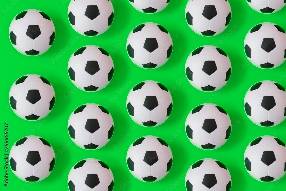 Many black and white soccer balls background. Football balls in a water Many black and white soccer balls background. Football balls in a water