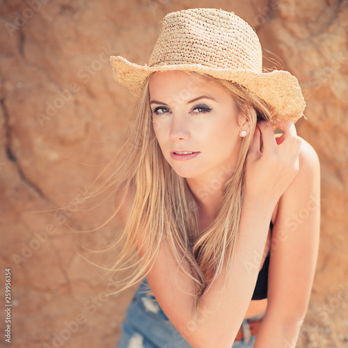 young woman in straw hat