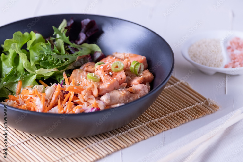 Donburi salmon meal with salad