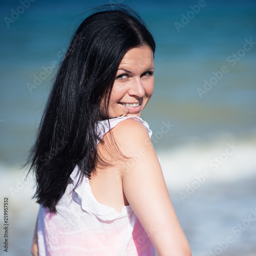 Happy Woman Smiling. Rest on a beach