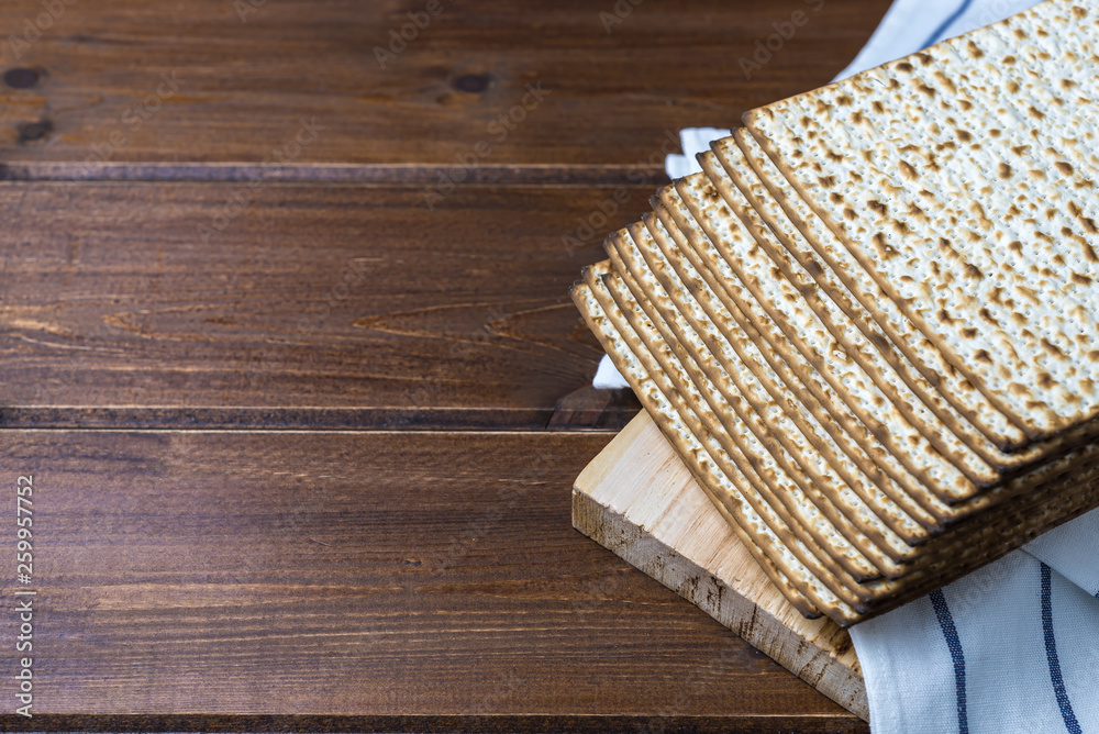 Stack of matzah or matza on a wooden table Stack of matzah or matza on a wooden table