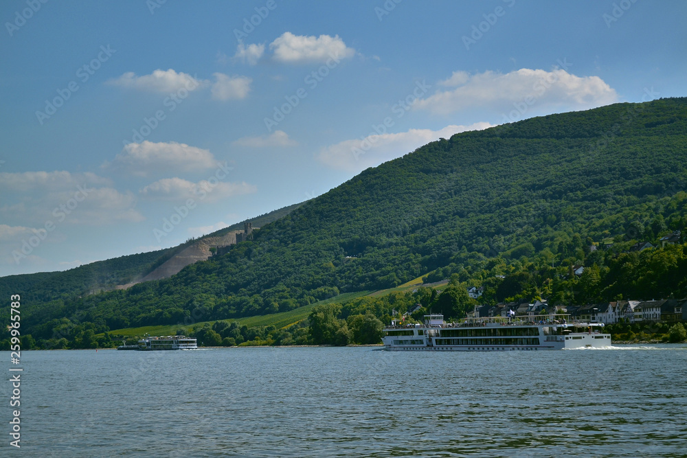 ferry floats on the river against the backdrop of the village ferry floats on the river against the backdrop of the village