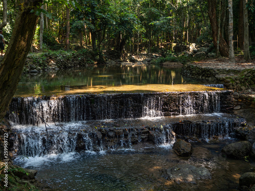 Fototapeta Naklejka Na Ścianę i Meble -  Water flows over the rocks of the waterfall on Koh Phangan. Thailand