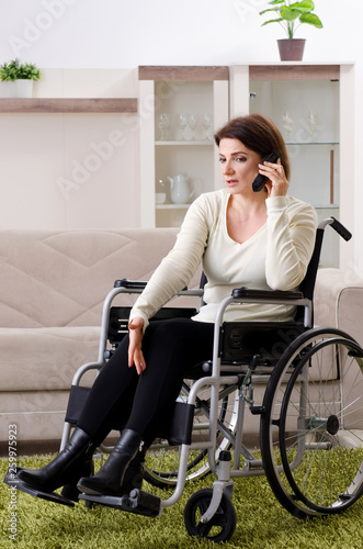 Woman in wheelchair at home 