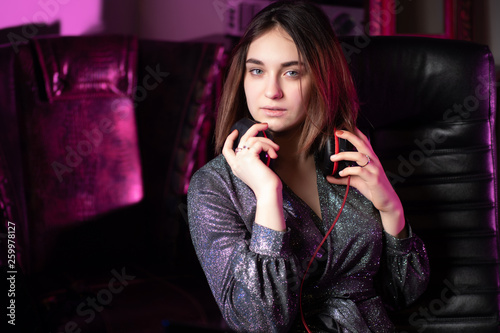 Attractive girl with headph...