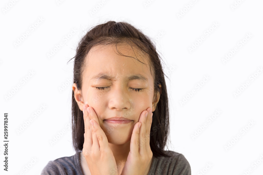 Asian little girl washing face with foaming cleanser,foam cleansing formula without bubbles for child, isolated on white background Asian little girl washing face with foaming cleanser,foam cleansing formula without bubbles for child, isolated on white background