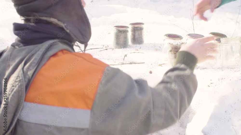 Close up. Ecologist taking glass jar for soil samples Close up. Ecologist taking glass jar for soil samples