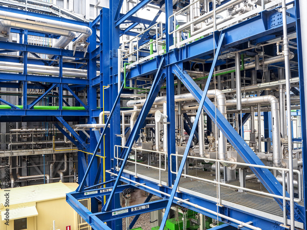 Steam pipe line and blue pipe rack in power plant. Steam pipe line and blue pipe rack in power plant.
