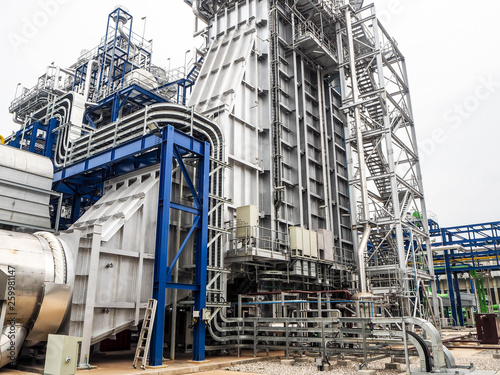 Heat recovery steam generator and sky in Combined-Cycle Co-Generation Power Plant which it so beautiful and popular to background power plant concept.