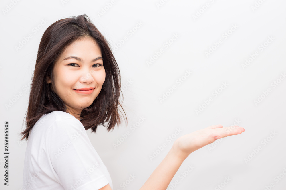 Beautiful asian wellness smiling women show welcome hand sign Beautiful asian wellness smiling women show welcome hand sign