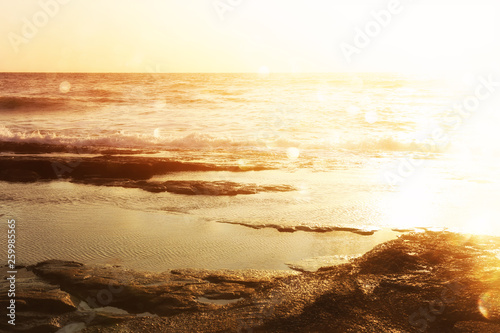 background image of sandy beach and ocean waves