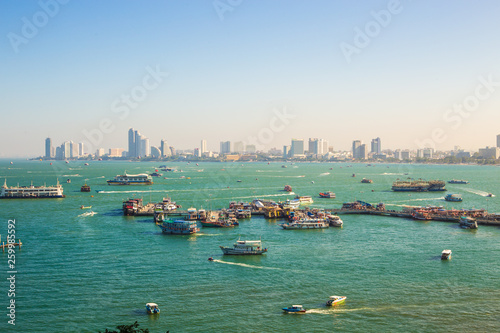 Pattaya bay viewpoint with travel boat in morning