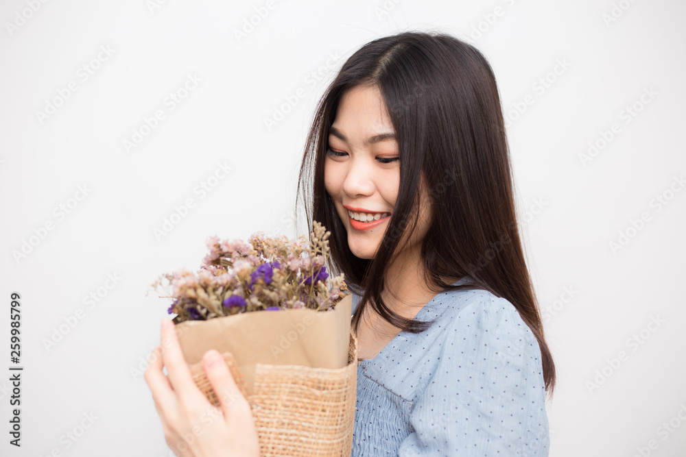 Beautiful women holding bouquet of dry wild flower Beautiful women holding bouquet of dry wild flower