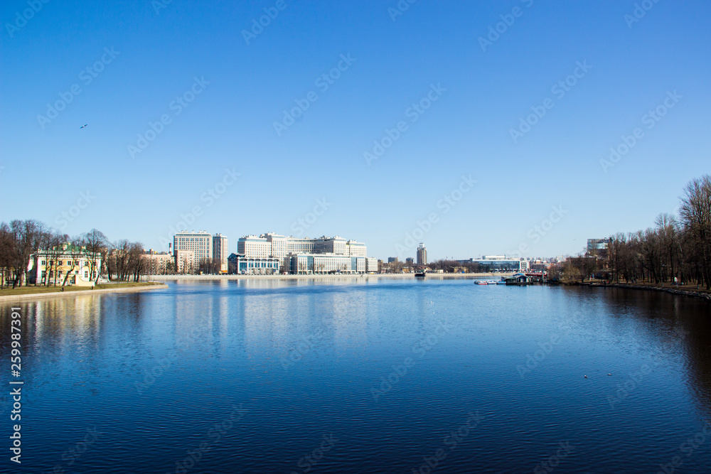 St. Petersburg, Russia, April 06, 2019: Neva river and view of Ushakovskaya embankment. Travel, architecture, sightseeing concept.