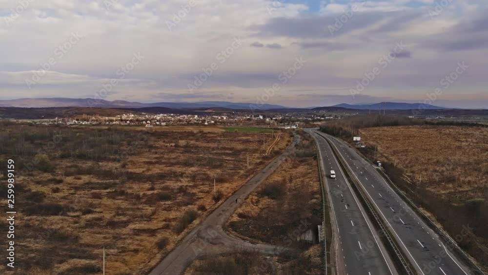 Aerial view aerial flythrough of road blue sky white clouds beautiful landscape. Aerial view aerial flythrough of road blue sky white clouds beautiful landscape.